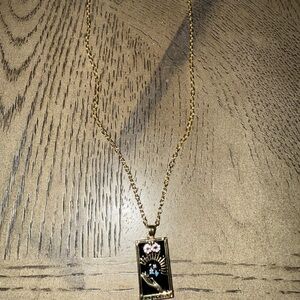 Gold Pendant Necklace with Black and Blue Accents